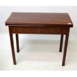 A George lll mahogany concertina action card table, with square tapering chamfered legs,