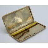 A 9ct gold engine turned cigarette case hallmarked Birmingham 1926, maker's mark B & S, 223.8g.