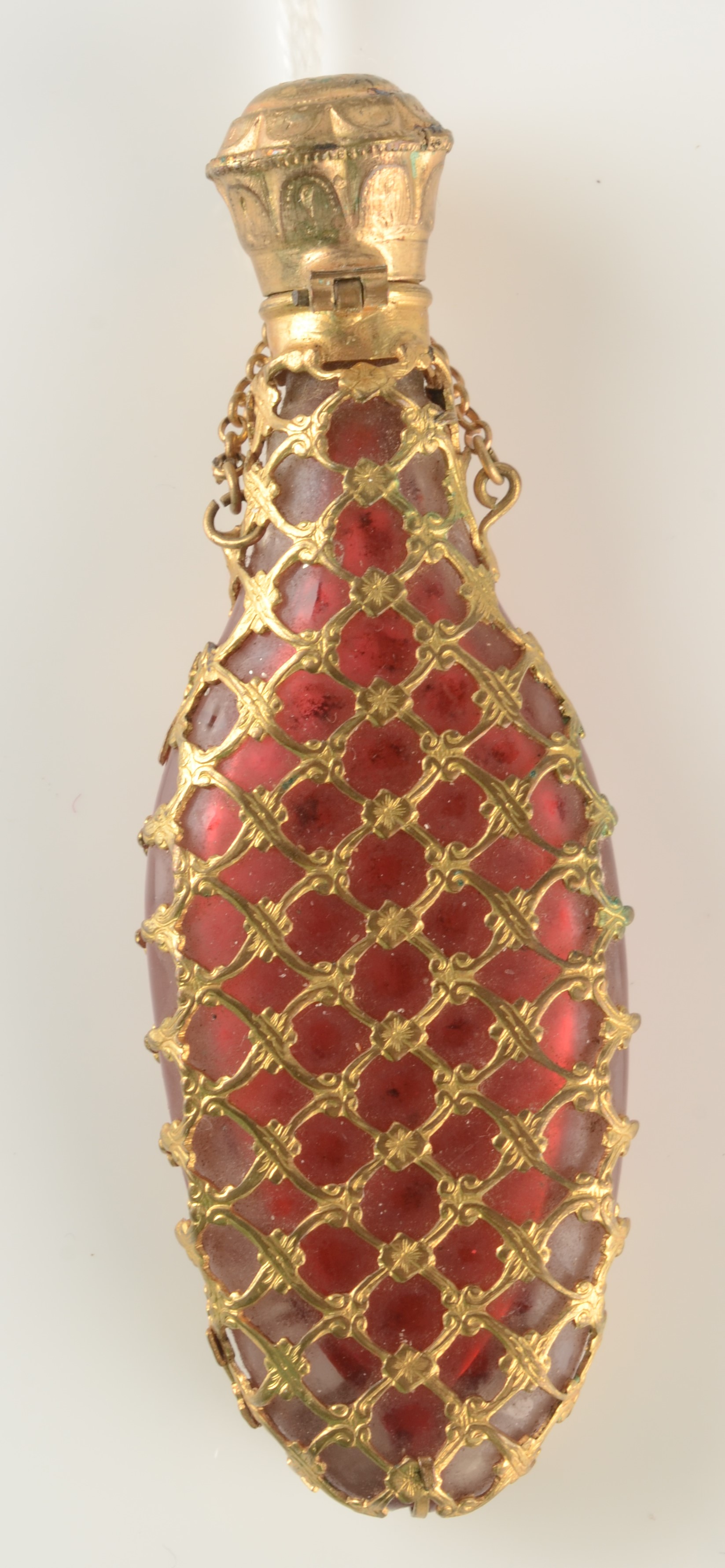 A cranberry glass early Victorian gilt metal mounted perfume flask.