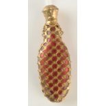 A cranberry glass early Victorian gilt metal mounted perfume flask.