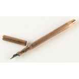 A 9ct gold De La Rue engine turned Onoto fountain pen, London 1913, total weight 20.7g.