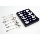 Various silver teaspoons and a pair of silver sugar tongs, 4oz.