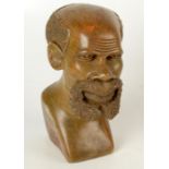 An African stone bust of a bearded man, height 22.5cm.