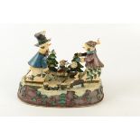 A Mr and Mrs Snowman metal automaton, circa 1930's, with jingle bells tune,