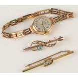 A ladies gold cased Rotary wristwatch on 9ct. gold bracelet, together with two gold bar brooches.