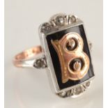 A 9ct gold and silver ring with a gold initial 'B'.