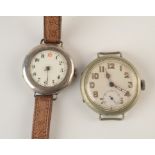 A nickel trench type cased open faced wristwatch and a smaller silver cased trench wristwatch.