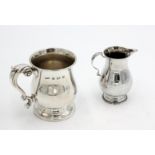 A modern bellied silver mug, together with a modern silver cream jug, 8.6oz.