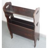 An Art Nouveau style mahogany book rack, with a pair of pierced handles and heart motifs,