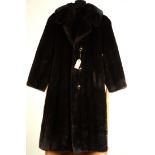 A dark brown three-quarter length faux fur ladies' coat by Jeannie, size 12, length 42cm.