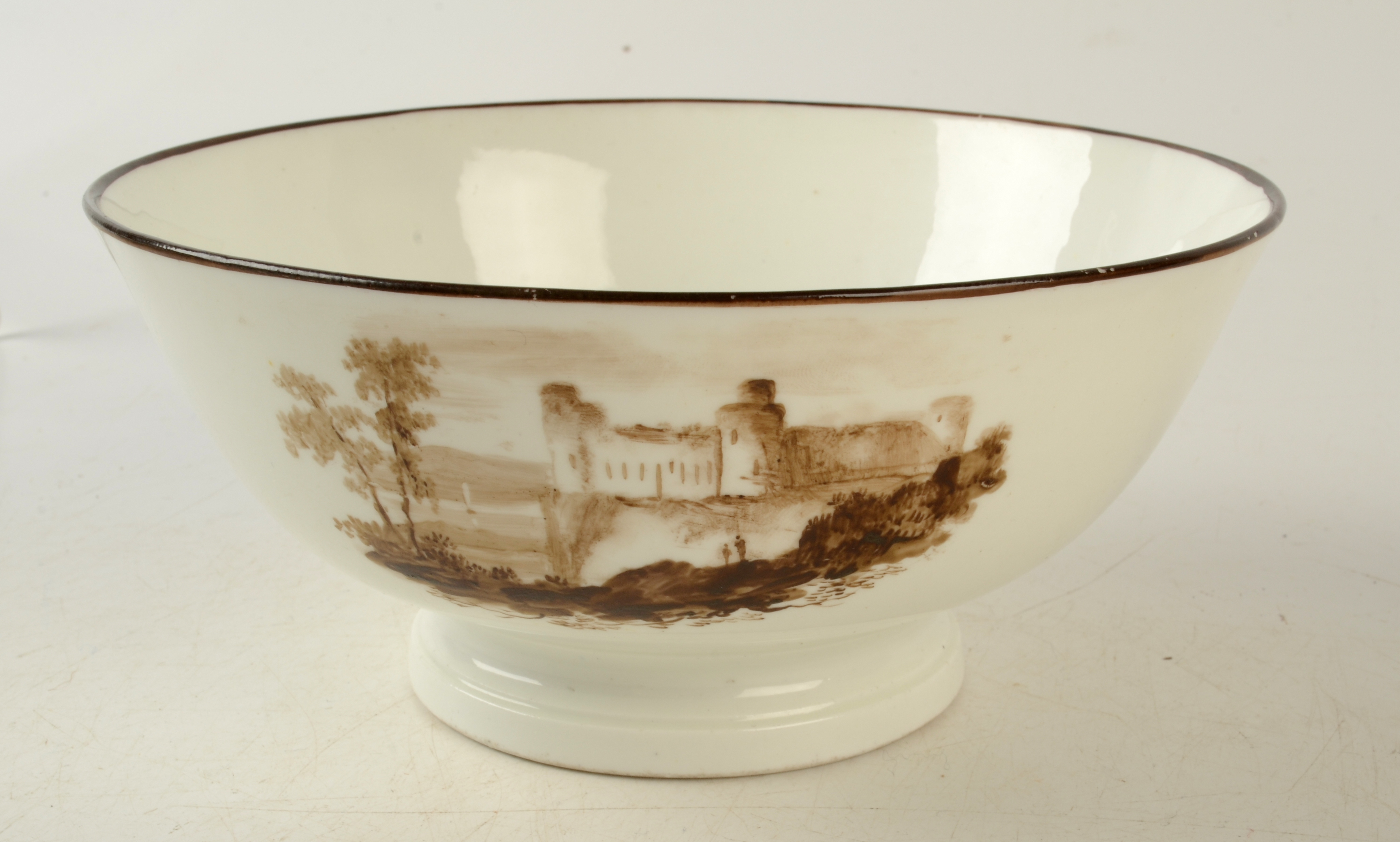 An 18th century Swansea porcelain bowl painted with three sepia landscape vignettes, - Image 3 of 4