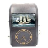 A Vitascope Industries Ltd bakelite electric ship automaton clock, height 32.5cm, width 27.