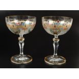 A set of six Czech champagne glasses, with painted and gilt decoration, height 14cm, boxed.