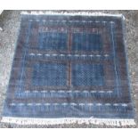 A Pakistan rug, of Turkoman Ensi design, the blue ground with a mihrab filled with candelabra,