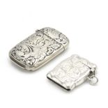 A shaped silver vesta case and an American silver vesta case each with chased scrolling acanthus