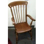 A spindle back kitchen armchair, height 107cm, width 45cm.