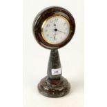 A Cornish serpentine mantel clock, height 32cm, diameter 15cm.