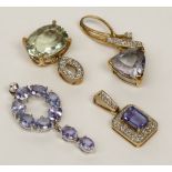 Four 9ct gold coloured stone and diamond set pendants.