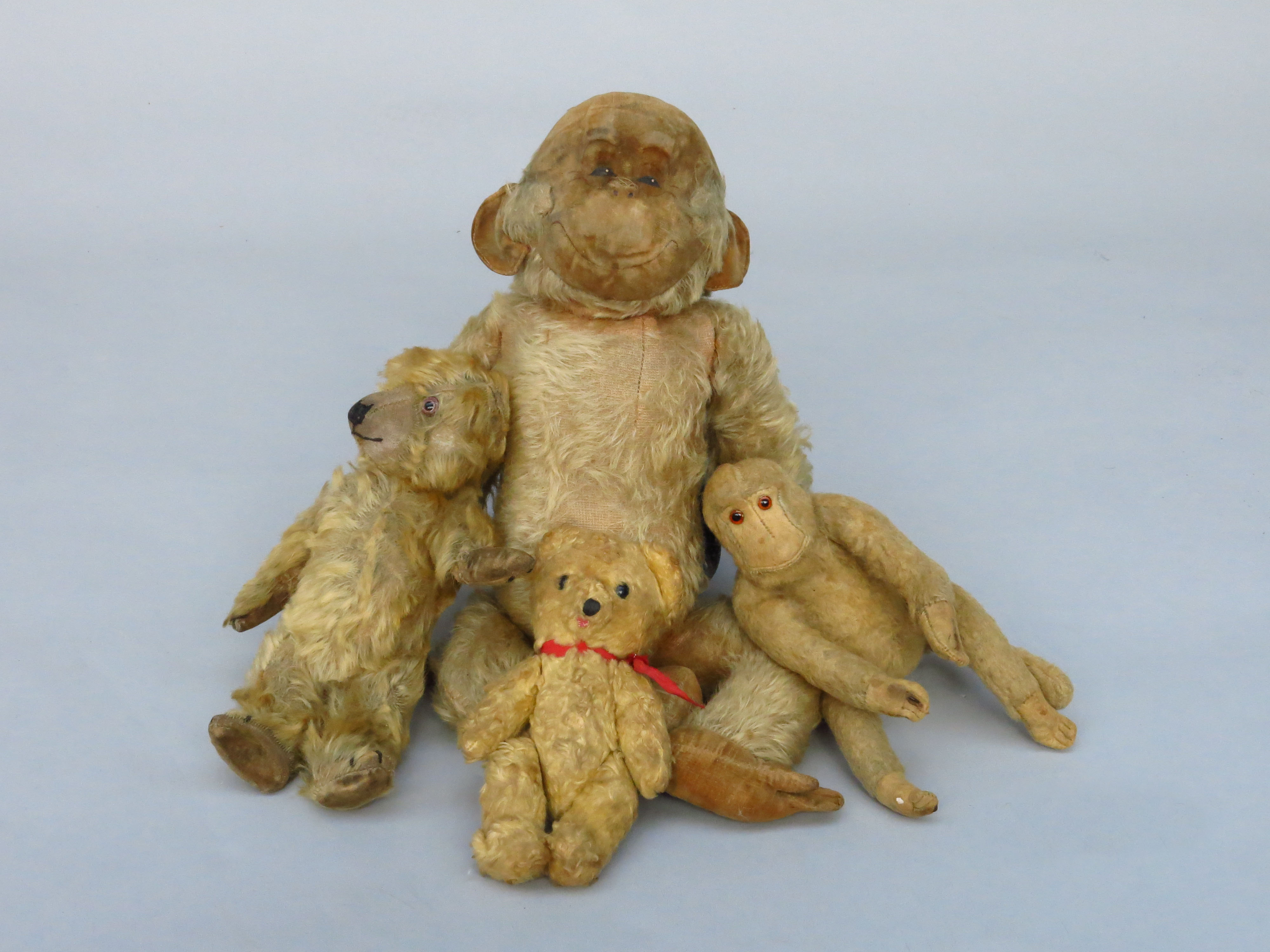 A Merrythought plush monkey, probably 1950s, with stitched label, length 37cm,