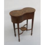 An Edwardian kidney shaped inlaid work table, with square tapering legs and spade feet, height 73cm,