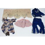 Vintage Chinese clothing to including a pink child's jacket and a pair of leather shoes.
