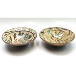 An Afghan pottery bowl, painted in green and brown with stylised flowers,
