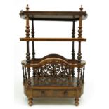 A Victorian burr walnut canterbury, with three tiers and a single drawer, on turned legs,