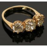 An 18ct gold three stone diamond ring, together they total just over three carats.