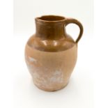 A large pottery jug, possibly Bridgewater, early 20th century, with unglazed lower body,