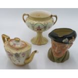 Two Staffordshire pottery spaniels, the largest 33cm,a Royal Doulton character jug, Monty,