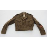 A West Buckland army jacket, length 56cm.