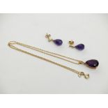 An amethyst 9ct gold mounted pendant and chain together with a pair of matching earrings.