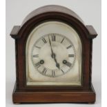 A mahogany cased mantel clock, 1920s, the arched silvered dial signed John Perry Ltd Nottingham,