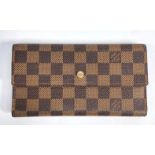 A Louis Vuitton chequer wallet, leather lined interior and branded fabric storage bag, height 11cm,