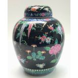 A large Chinese famille noire ginger jar and cover, height 33cm.