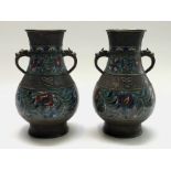 A pair of Chinese bronze champleve vases, 19th century, height 34cm.