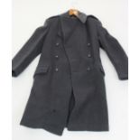 A Royal Air Force Greatcoat, with label inscribed 'R.E. CITY Ltd London', length 113cm.