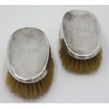 A pair of silver mounted brushes.