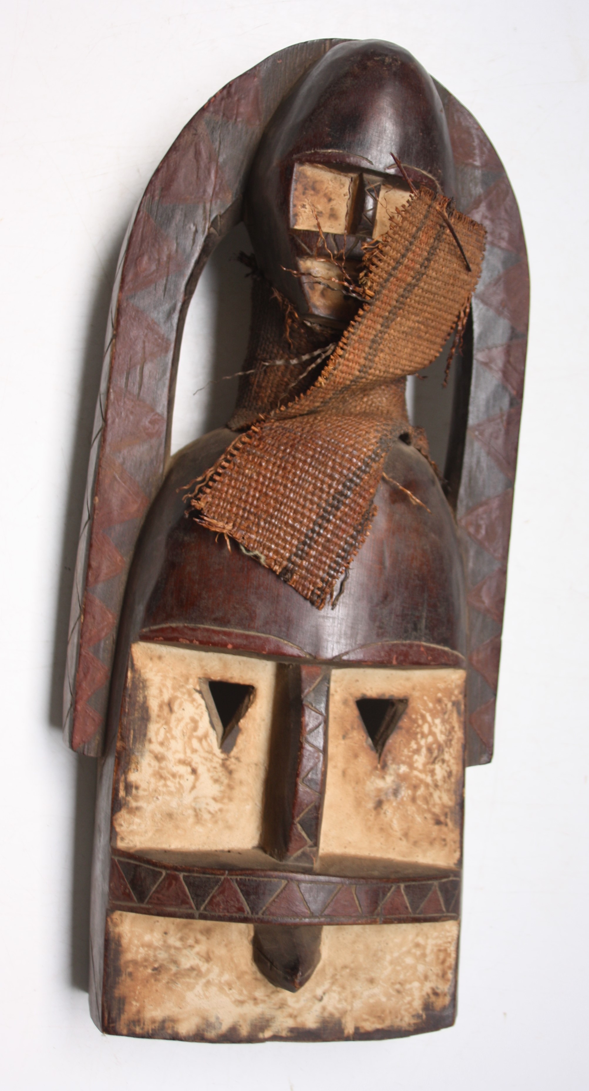 An African wooden Dogon tribal two-headed mask, Mali, height 44cm width 19cm.