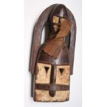 An African wooden Dogon tribal two-headed mask, Mali, height 44cm width 19cm.