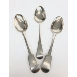 A Georgian silver fiddle pattern serving spoon, together with two other silver serving spoons, 6.