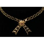 A 1970's 9ct gold necklace joined by a ruby set starburst, 22.3g.