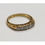 An 18ct early 20th century Chester hallmarked gold ring set with five graduated diamonds.