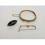 A Victorian gold mounted onyx brooch, a 9ct gold hunting brooch and a gilt hinged bangle.