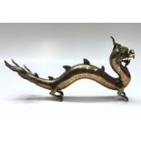 A Chinese brass figure of a dragon, height 16.5cm, length 35cm.