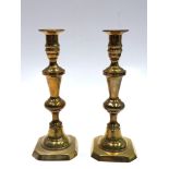 A pair of Victorian brass ejector candlesticks, height 25cm.