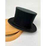 A collapsible opera hat, by Austin Reed, original card box together with a walking stick.