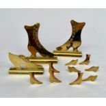 A pair of Victorian brass boot hearth ornaments, height 13cm, a similar shoe,