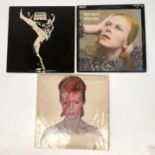 Three David Bowie albums, 'Aladdin Sane', 'The Man who Sold the World' and 'Hunky Dory'.