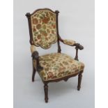 A nautical walnut open armchair, 19th century, the padded back and seat flanked by carved ropes,